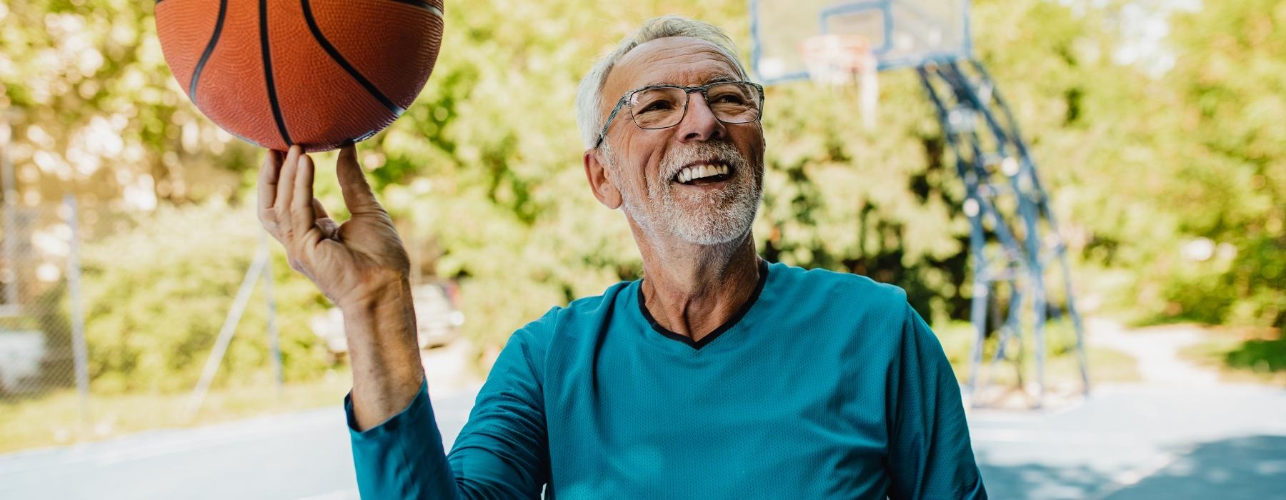 a man holding a basketball